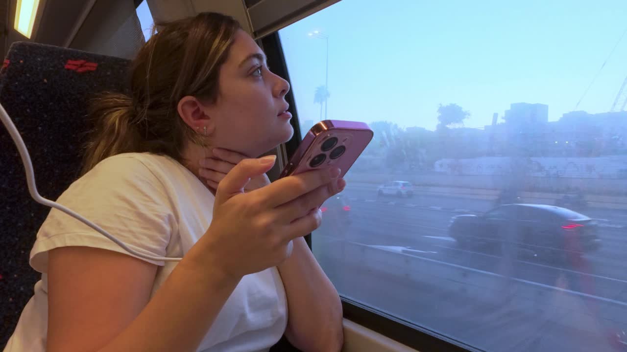 A Travelers Evening Commute with Her Smartphone