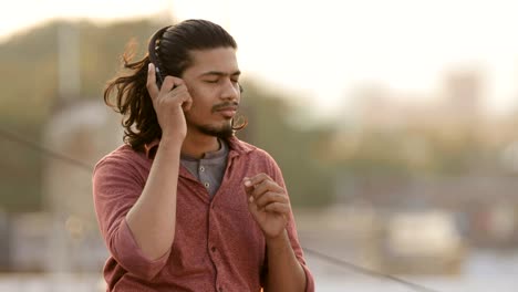 young man enjoying music on headphones