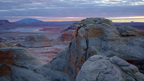 the sweeping aerial footage unveils the stunning rock formations and desert textures of glen canyon.
