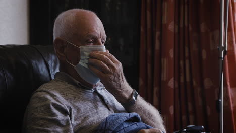 elderly man wearing a face mask for protection against covid-19