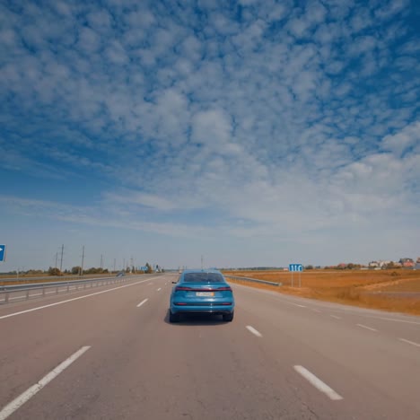 Luxury comfortable ecology electric vehicle on the road. Modern electric car on the road with blue sky