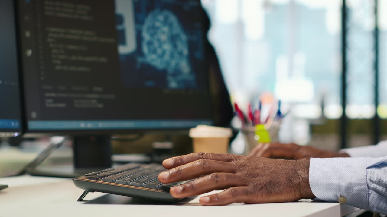 Technician Using Mockup Laptop Next To Office Coworkers Developing Applications