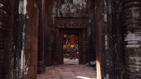 champassak / laos - feb 13: vat phou – ruined khmer hindu mountain temple. buddhist altar buddha statues. holy place for prayer. buddhism religion. unesco world heritage. ancient temple complex. slow