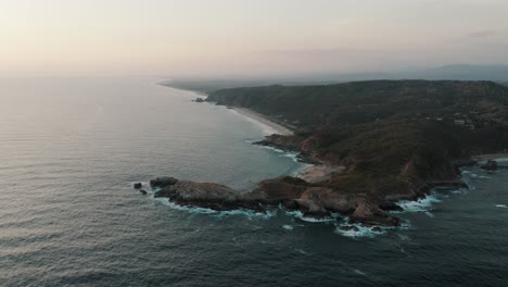 panoramic view on seascape in mazunte, mexico on a cloudy day - aerial drone shot