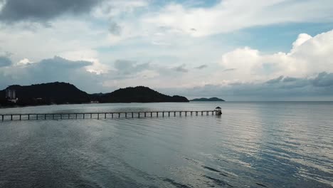 Fly-toward-Gertak-Sanggul-bridge-during-cloudy-day-in-evening.