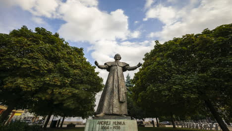 time lapse footage of historical statue of andrej hlinka in žilina city centre, slovakia.