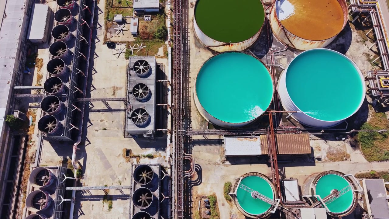 Industrial facility located near a highway with water treatment tanks