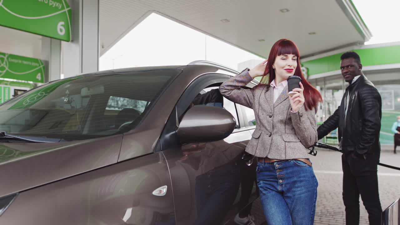 Woman and Man at a Gas Station