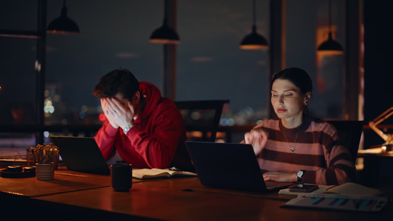 Stressed and Overworked Employees at Night