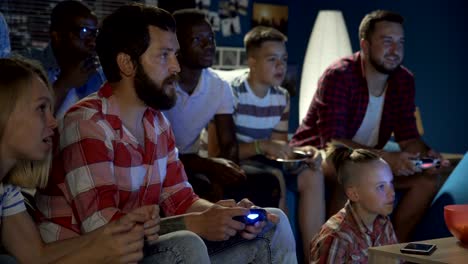 diverse people entertaining with videogame