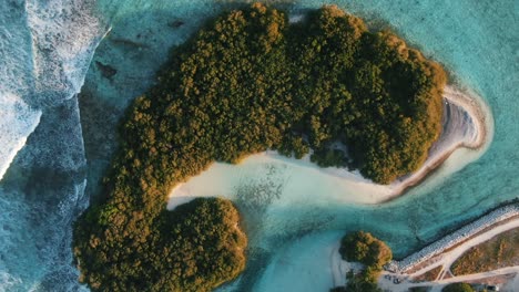 green-island-with-white-sand-beach-waves-and-blue-lagoon-surfing-spot-cokes