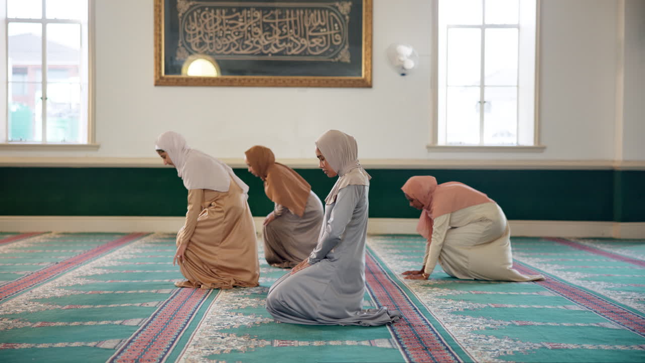Muslim women praying in a mosque