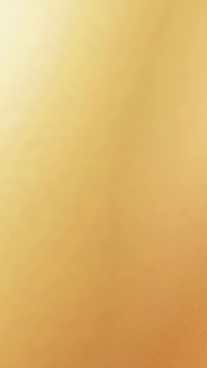 Vertical video: Covering fingertip pressing phone lens, obscuring home view while adjusting device