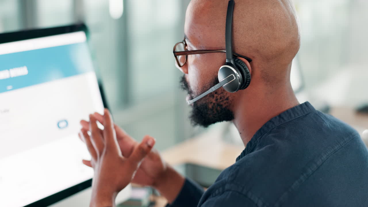 Customer Support Agent Working on Computer