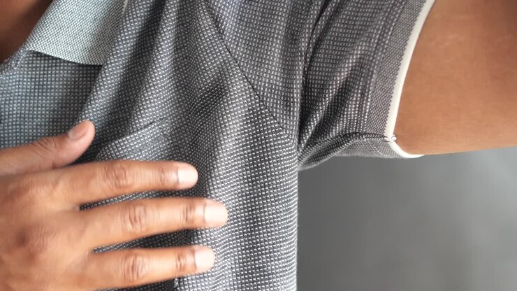 Close-up of a person's underarm and shirt