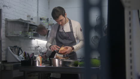 chef preparing sweet potatoes in a restaurant kitchen