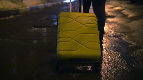 walking alone with trolley bag at night