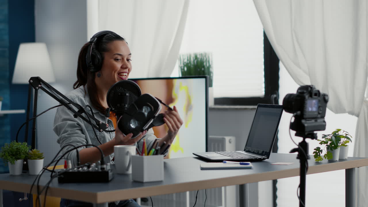 Famous influencer reviewing high tech VR headset while filming recommendation video