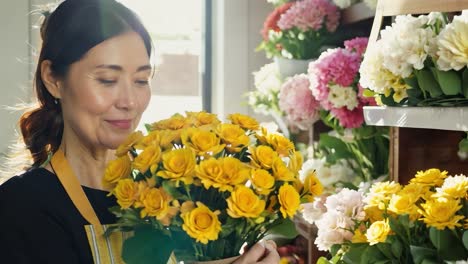 smiling florist arranging flowers