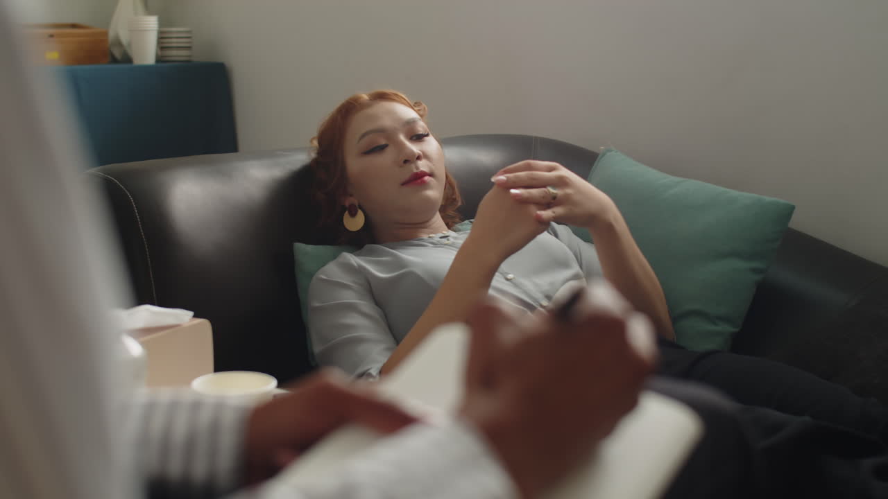 Woman Explaining Symptoms during Session with Psychologist