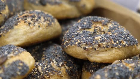 warm freshly baked breakfast rolls with seeds displayed on tray