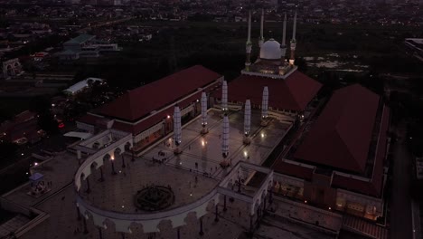 aerial drone view of central java great mosque (masjid agung jawa tengah) in sunset time, semarang, central java, indonesia on june 10, 2022
