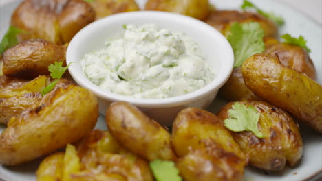 sauteed potatoes on a white plate rotating