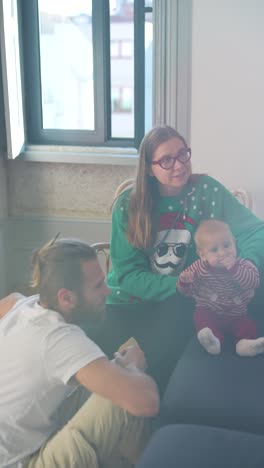 family with baby celebrating christmas