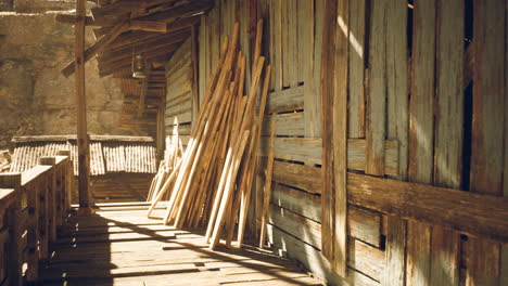 wooden structure with planks in sunlight at rustic outdoor location