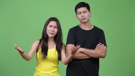 young asian couple being angry together
