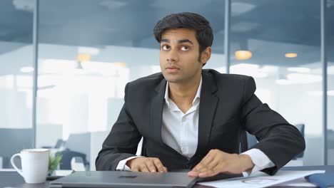 indian employee wakes up from sleep and starts working