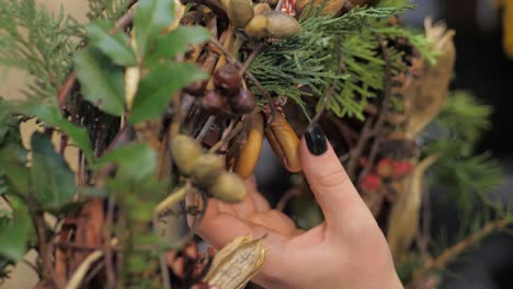 florist at work. how to make christmas wreath with floral arrangement. step by step, tutorial