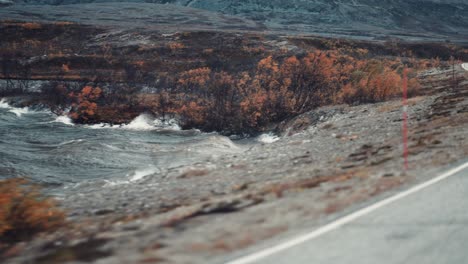 drive along the shoreline on a stormy day