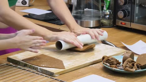 rolling out gingerbread dough