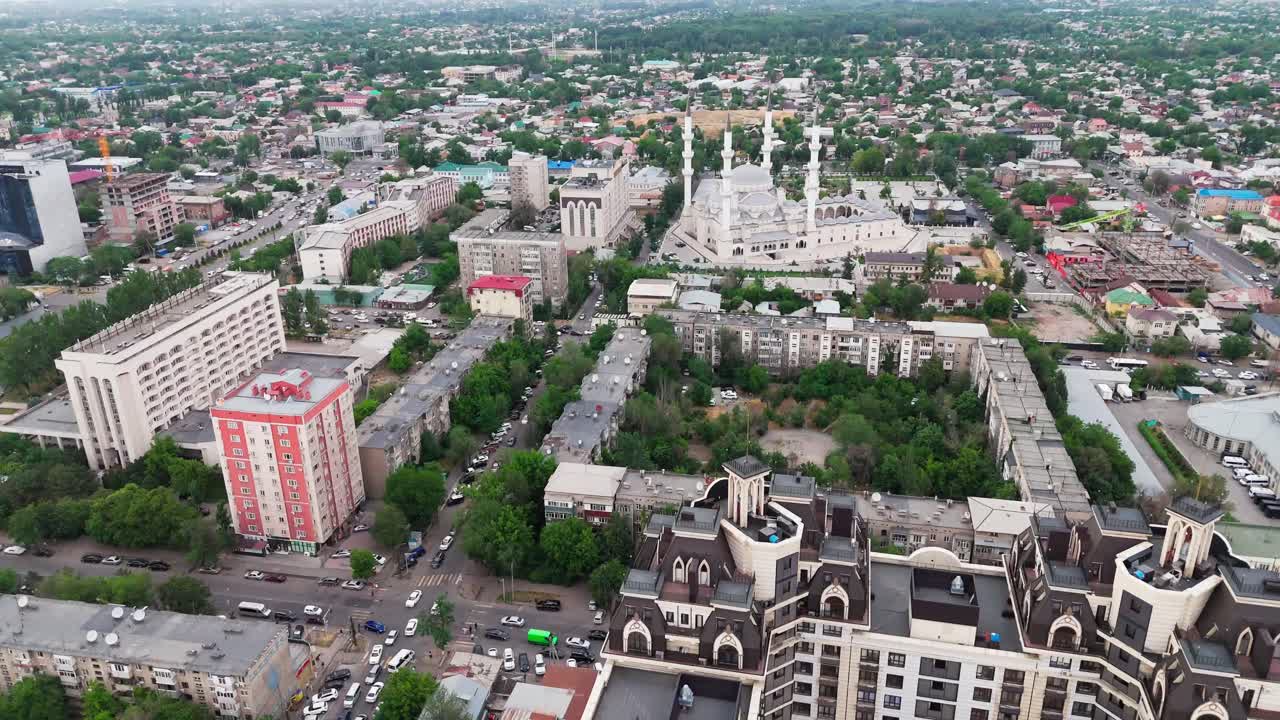 Drone fly above Bishkek, the capital city of Kyrgyzstan revealing the central mosque and skyscraper building