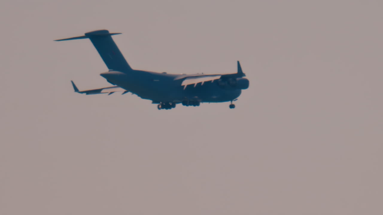 Antibes, France - April 5, 2025: Blurred view of an airplane flying in the cloudy sky