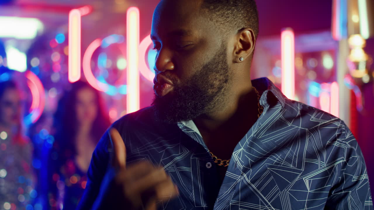 African american man talking at party. Afro guy gesticulating in nighclub