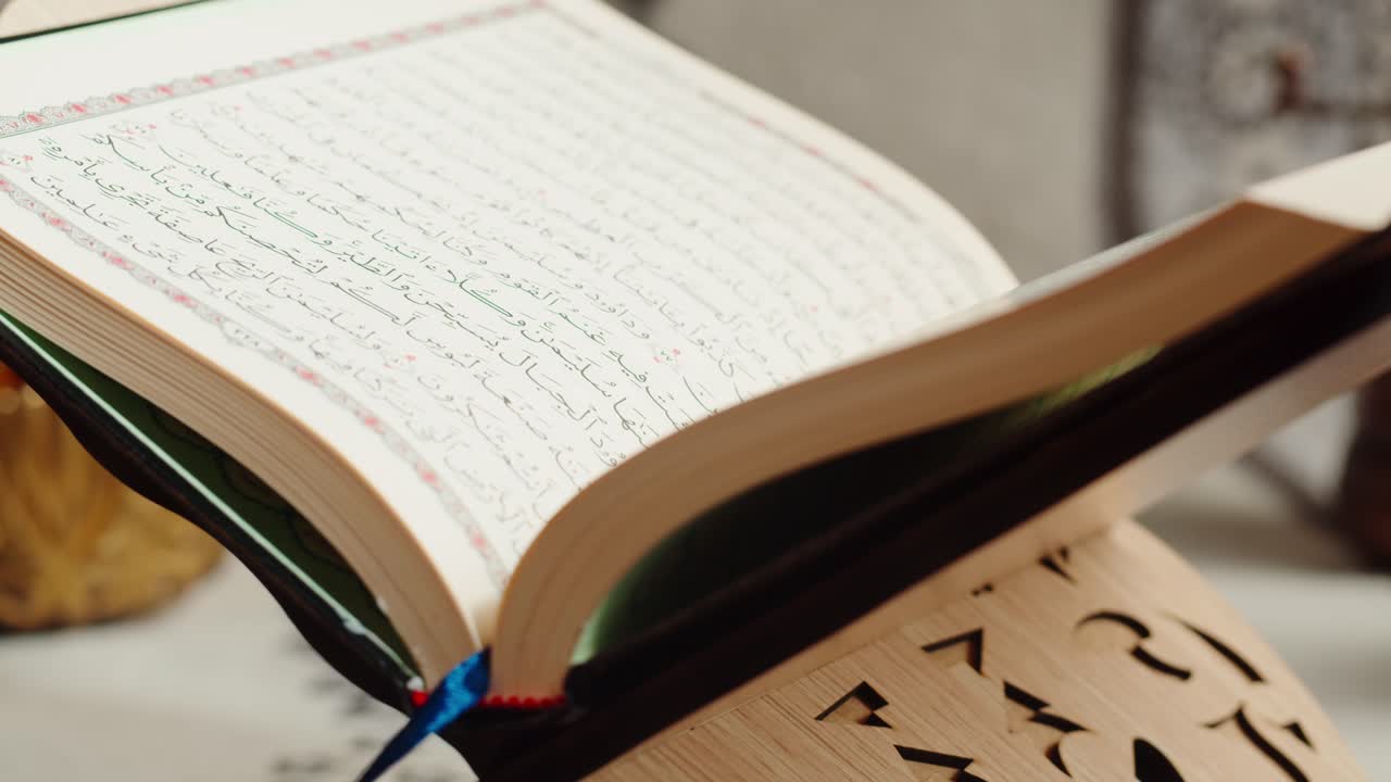 An Open Quran on a Wooden Stand