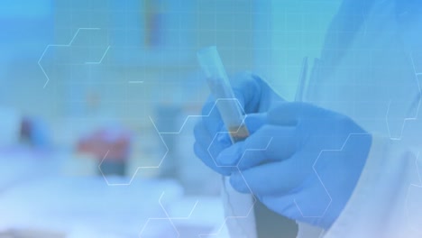 Chemical-structure-moving-against-mid-section-of-scientist-holding-test-tubes-in-laboratory