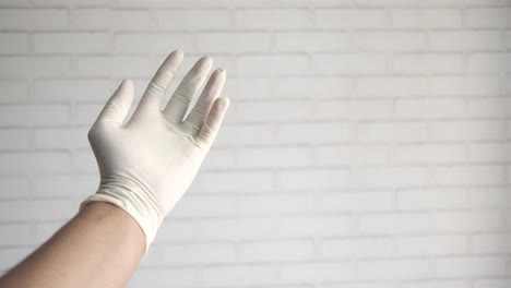 hand in latex gloves