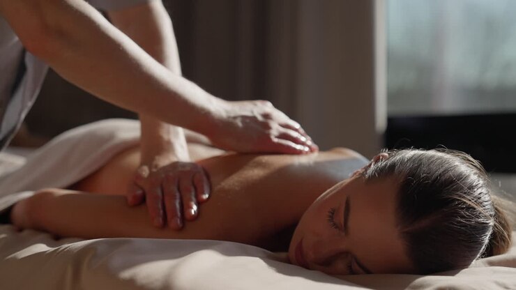 Woman Receiving Relaxing Back Massage at a Spa