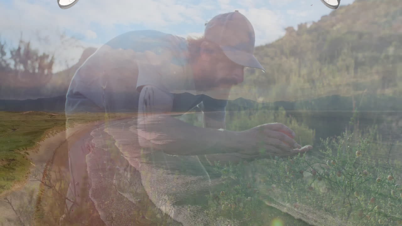 Tending plants, man in garden with animation of scenic mountain landscape