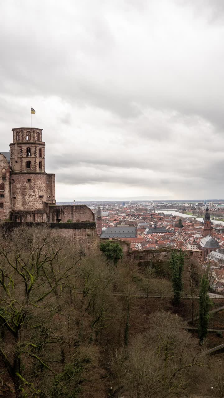 Ancient Heidelberg Castle ruins with dramatic clouds in a moody time-lapse view