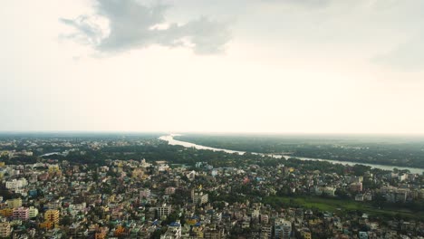 panoramic drone shot of murshidabad, with its architectural gems set against the backdrop of the river.