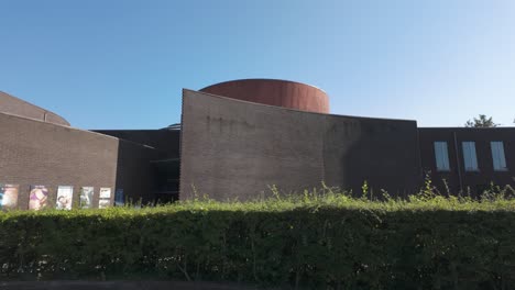 modern architecture of the thermes de spa building in belgium with clear blue sky and greenery