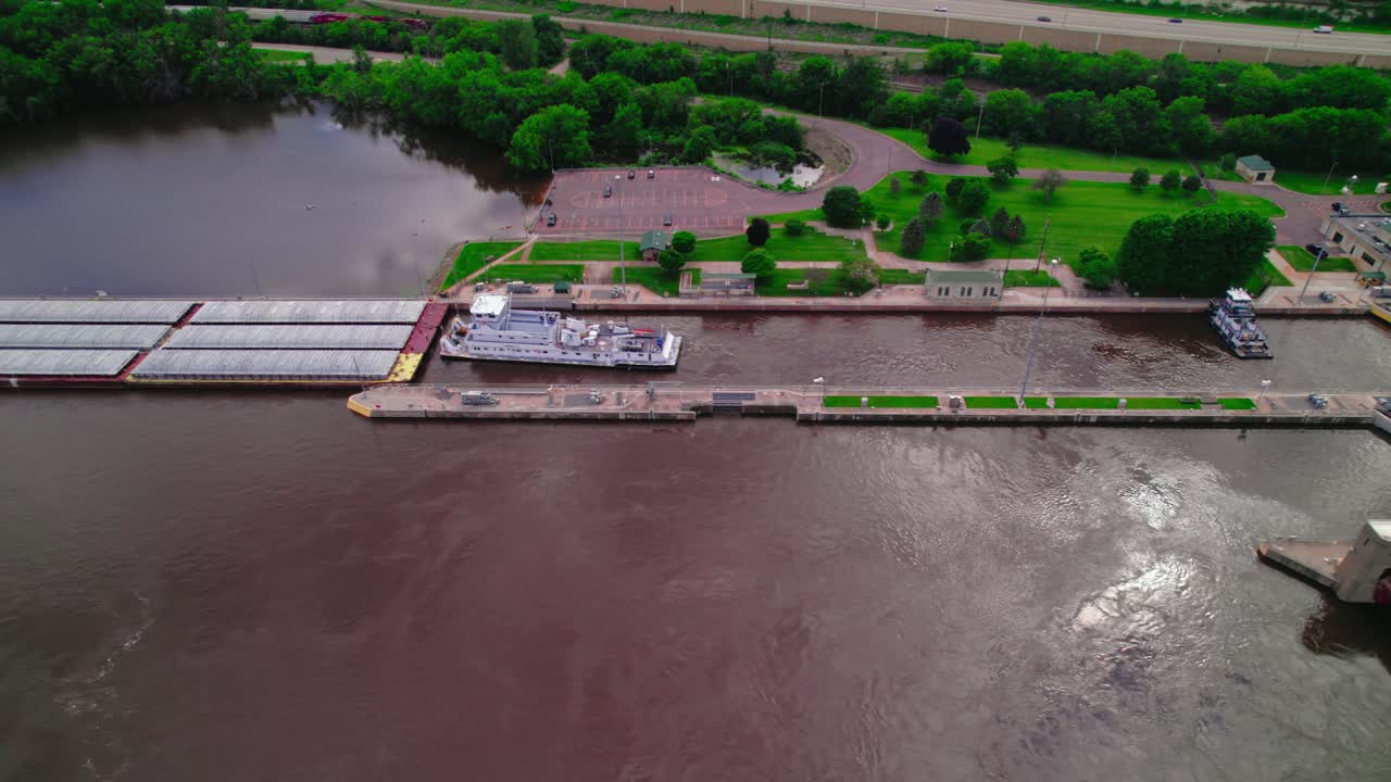 Aerial view of a barge being loaded at a dock on the Mississippi River near La Crescent, Minnesota
