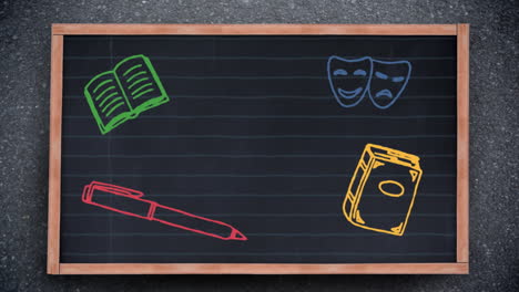 multiple school concept icons on black board