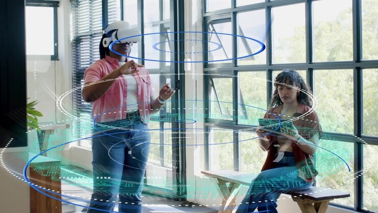 Lead with VR headset raising hands and starting holo rings while operator tapping tablet for tech