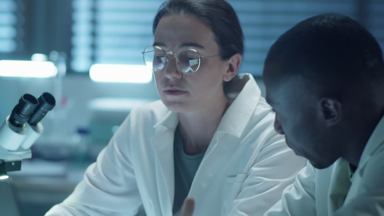 Diverse Scientists Having Discussion in Laboratory