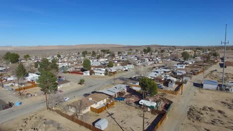 aerial over a lonely desert community in the mojave desert of california